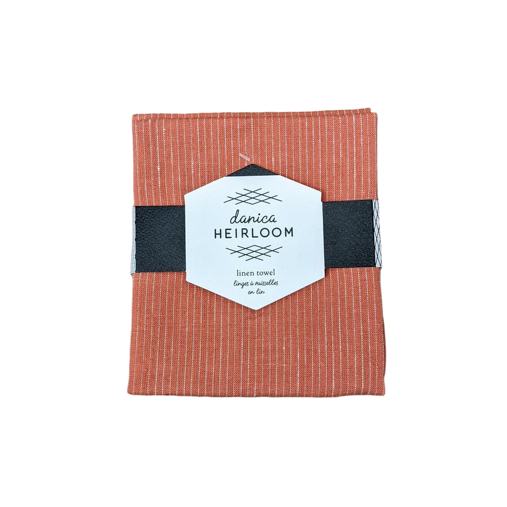 Clay linen towel with 'danica Heirloom' label 